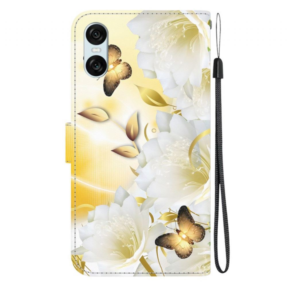 Kožený Kryt Sony Xperia 10 Vi Zlatí Motýli A Bílé Květy S Popruhem