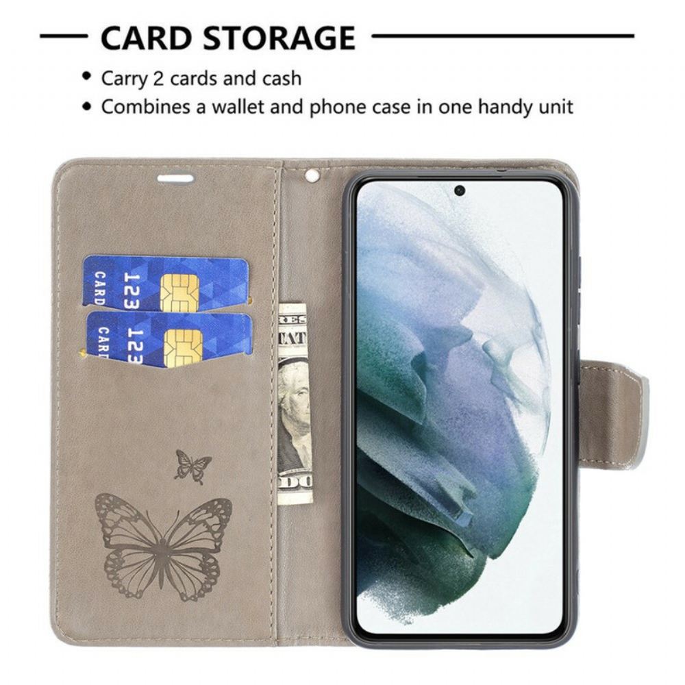 Flipové Pouzdro Na Samsung Galaxy S21 FE Motýli V Letu S Lanyardem