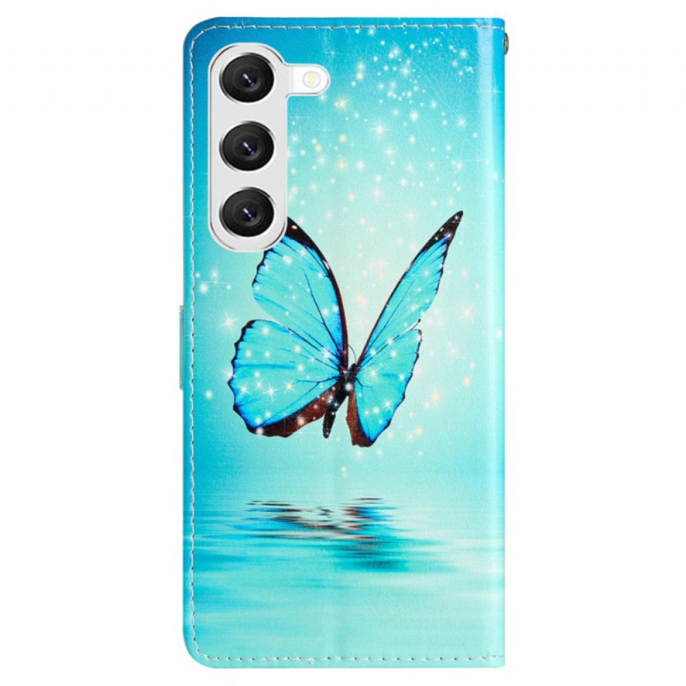 Kožený Kryt Na Samsung Galaxy S24 5g Modrí Motýli S Popruhem