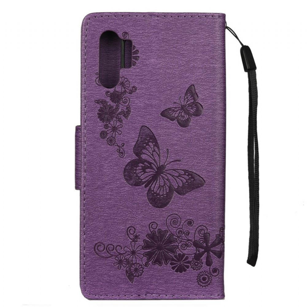 Kožené Pouzdro Na Samsung Galaxy Note 10 Plus Na Lana Motýli A Květinové Vazby